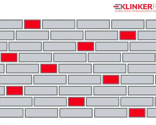 Graue Ziegelsteine in einem wilden Verband mit einigen roten Akzenten.