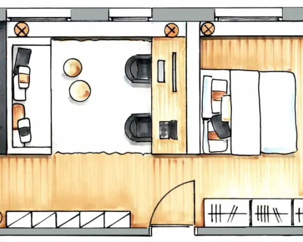 Grundriss einer kleinen Wohnung: Küche, Wohnbereich mit Sitzgelegenheiten, Schlafbereich mit Bett und ein Badezimmer.
