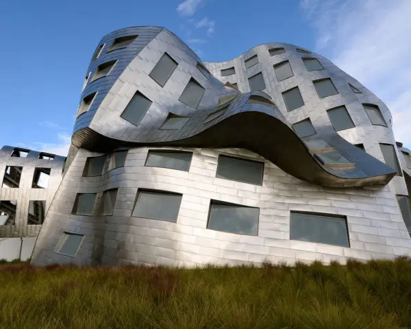 Ein futuristisches Gebäude mit geschwungenen Metallfassaden, typisch für Frank Gehry Bauwerke, ragt aus hohem Gras empor.