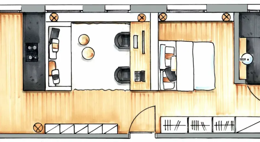 Grundriss einer kleinen Wohnung: Küche, Wohnbereich mit Sitzgelegenheiten, Schlafbereich mit Bett und ein Badezimmer.