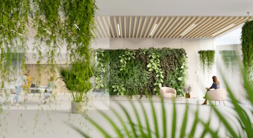 Ein Büro mit biophilem Design: Eine üppige grüne Wand und hängende Pflanzen schaffen eine beruhigende Atmosphäre. Menschen arbeiten und entspannen sich inmitten der Natur.