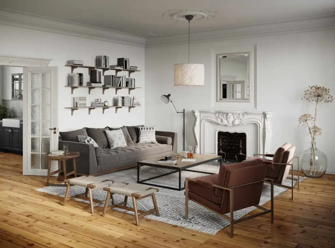 Gem&uuml;tliches Wohnzimmer mit einem Teppich unter dem Sofa und davor, Kamin, B&uuml;cherregale und zwei Sessel.