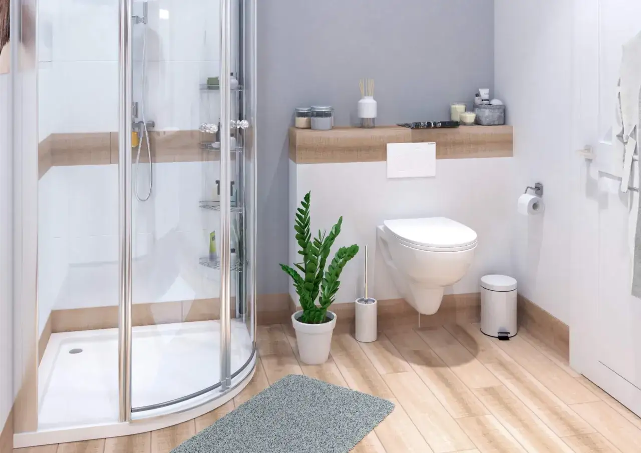 Ein kleines Badezimmer modern gestalten: Duschkabine, H&auml;nge-WC, Pflanzen und Holzoptik schaffen eine Wohlf&uuml;hloase.